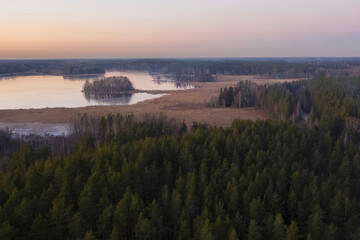 Islands on  Lake Vuoksa by the forest  in the Leningrad region near the town of Priozersk at sunset in late autumn, aerial view
