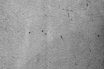 Texture of a concrete wall with cracks and scratches which can be used as a background