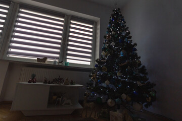 Christmas tree in the corner of the room