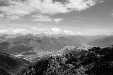 a landscape with mountains and clouds