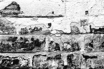Texture of a brick wall with cracks and scratches which can be used as a background