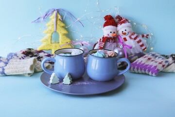 
Merry Christmas, a couple of cups of coffee with meringues, a warm scarf and decorations for the holiday, the concept of congratulations, home comfort, postcard