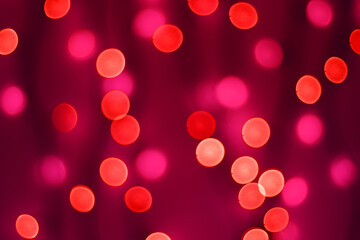 Abstract blurred bokeh lights on red background. Christmas and new year holidays light