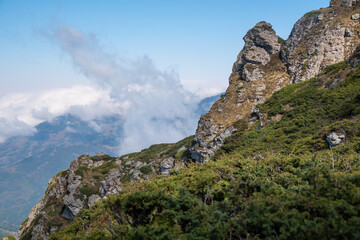 View from the top of Babin zub (The Grandmather's tooth) on Old mountain, which is the most beautiful peak of Stara planina ( Balkan mountains).The impressive and big striking rocks and dense plants.