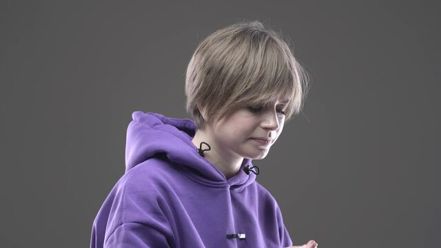Sick young stylish short haired girl taking painkiller meds to relieve headache pain or premenstrual syndrome