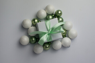 White gifts with mint ribbons. Set of gift box isolated on white background.Christmas gift boxes on white background. Beautiful Christmas background with shiny balls and ribbons in pastel mint color.