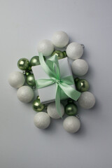 White gifts with mint ribbons. Set of gift box isolated on white background.Christmas gift boxes on white background. Beautiful Christmas background with shiny balls and ribbons in pastel mint color.