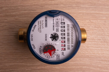 Household flow meter for cold water, blue, complete with connecting fittings and gaskets.