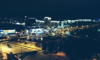 Fototapeta na wymiar Top view of the night winter city with lights and lanterns