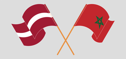 Crossed and waving flags of Latvia and Morocco