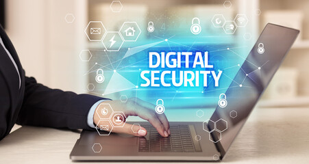 DIGITAL SECURITY inscription on laptop, internet security and data protection concept, blockchain and cybersecurity