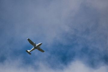 Tecnam P2006T plane, flying in the blue sky     