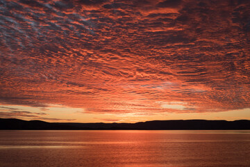 a sunset over a body of water