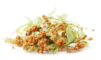 Heap of dried linden flowers on a white background. Isolated