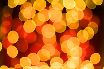 Abstract blurred bokeh lights on red background. Christmas and new year holidays light