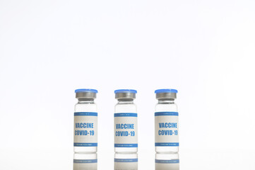 Fight against the coronavirus. Three ampoulses of covid-19 vaccine isolated on white. Healthcare and medicine concept