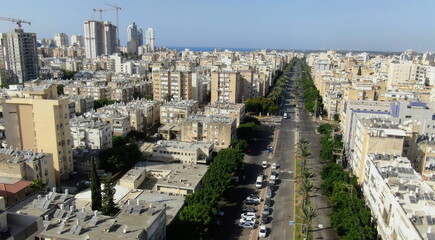 Fototapeta na wymiar Netanya, Israel from a bird's eye view. Top-down view of the city during the Yom Kippur holiday, when all highways and roads are empty. Cars are not allowed to drive on this day