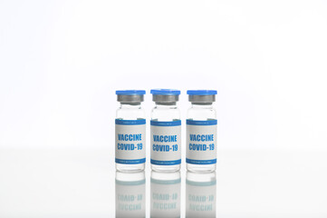 Fight against the coronavirus. Three ampoulses of covid-19 vaccine isolated on white. Healthcare and medicine concept