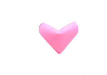 A pink origami heart isolate white