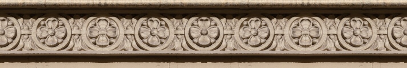 Elements of architectural decorations of buildings, gypsum stucco, wall texture, plaster molding and patterns. On the streets in Catalonia, public places. © Kozlik_mozlik