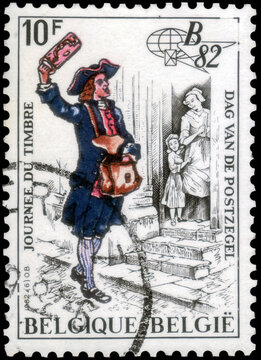Postage stamp issued in Belgium with the image of the Postman. From the series on Stamp Day,  1982