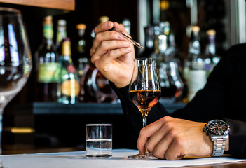 bartender pouring whiskey