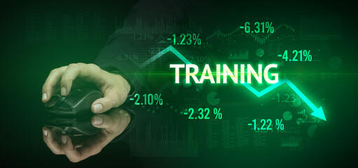 male hand holding wireless peripheral with TRAINING inscription, modern business concept