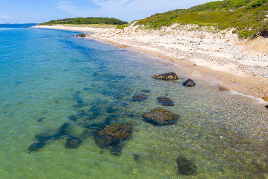 shore of island with focus on underwater rocks
