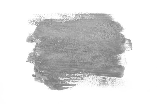 Trendy Color of the year 2021 Ultimate Gray. Sample of Ultimate Gray paint on white isolated background.Texture of gray paint. Fashionable Ultimate Gray pantone color of spring-summer 2021 season.