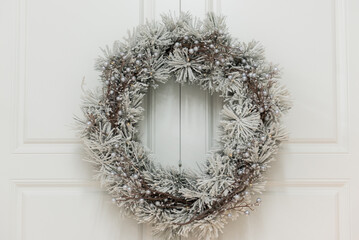 christmas wreath on the door © Olha