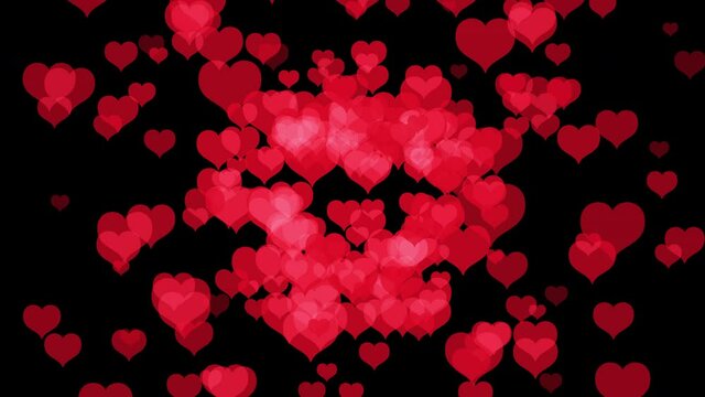 Animation of heart explosion. Bursts shiny hearts flying on a black background. Big hearts exploding into a lot of smaller hearts. Template for Valentine's Day or other celebration. 4K, Alpha chanel.