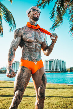 Sexy tattooed Santa Claus in speedos