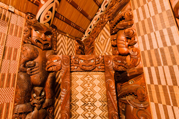 Carved panels inside of Maori meeting house in Waitangi, New Zealand