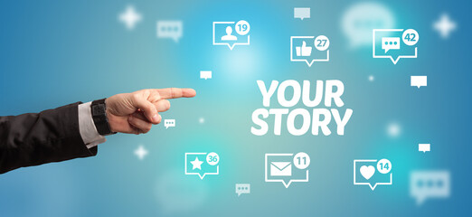 Close-Up of cropped hand pointing at YOUR STORY inscription, social networking concept