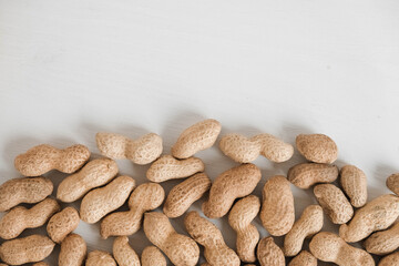 Peanuts in shell on a white background. Top view. Copy, empty space for text