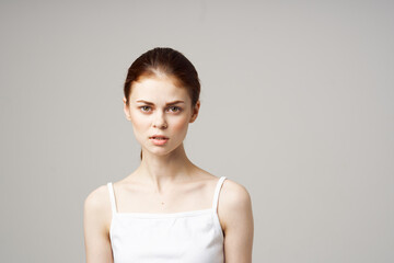 Obraz premium woman in white t-shirt emotions model bare shoulders health problems irritability