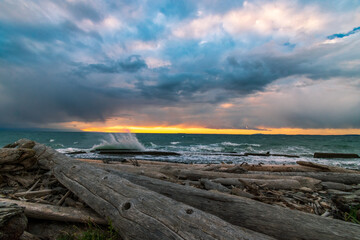 Waves splashing at Whidbey Island beach during sunset