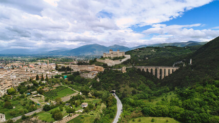 Fototapeta premium Ponte delle Torri and Rocca Albornoziana in Spoleto, aerial photography with drone, panorama of the city and typical medieval buildings