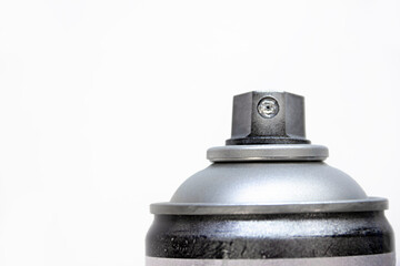  a graffiti spray can, closeup view of upper part of can