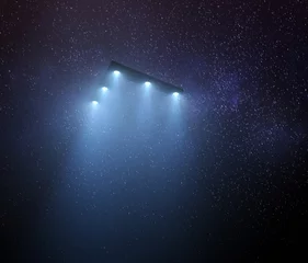 Gordijnen UFO Triangular Unidentified Flying Object. Unidentified flying object at night with fog and a light below. © ktsdesign