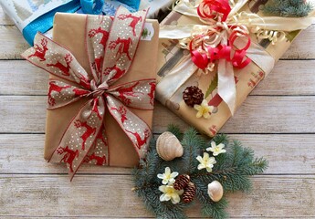 Holiday Christmas presents wrapped with elegant bows and ribbons ready for Santa Clause to deliver on Christmas Eve 