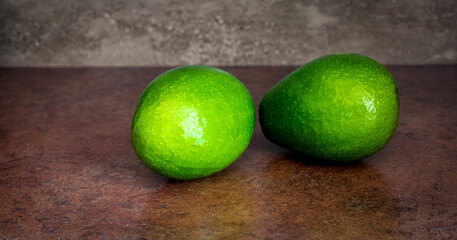 fresh green avocado on a marble table