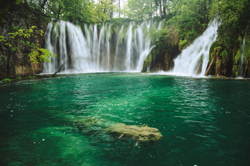 Fototapeta na wymiar Plitvice Lakes beautiful nature, wood bridge. lakes, waterfall, rainbow, rivers.