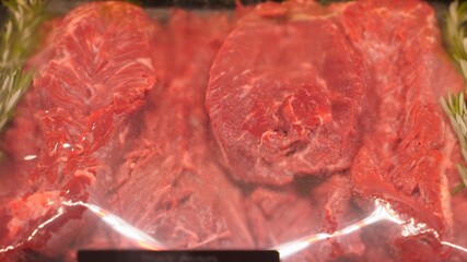 Red fresh beef steak in butchery display. Protein rich diet for meat eaters
