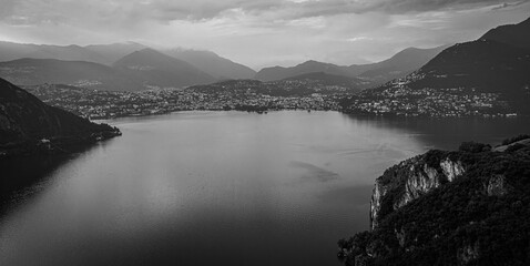 Aerial view over the Lake Lugano in Switzerland - evening view - drone footage