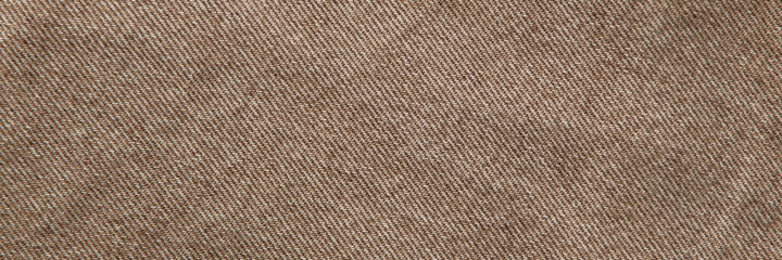 Fototapeta premium fabric grunge background, real cotton denim brown, wrinkled, frayed, close