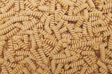 Bucati fusilli pasta background. Natural food, farm products concept.
