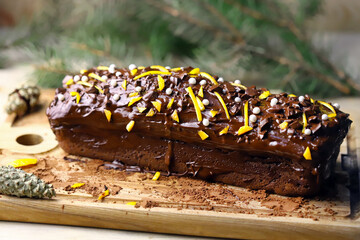 Selective focus. Christmas chocolate cake. Chocolate orange cake. Good New Year spirit.