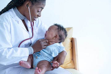 African doctor checking mix race newborn baby, Pediatrician examining baby girl with stethoscope