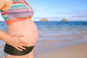 Pregnant woman on the beach, Lanikai, Oahu island, Hawaii